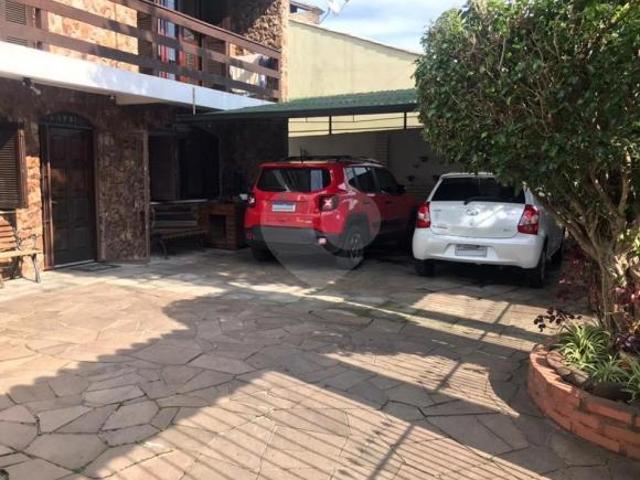Sobrado com 4 quartos à venda em Cavalhada RS