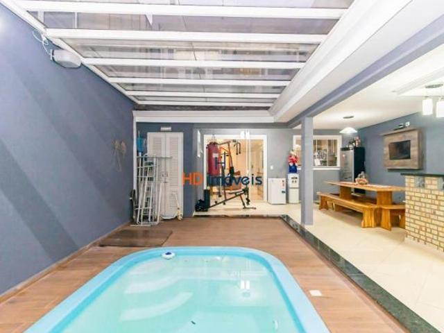 Sobrado com piscina privativa, 3 dormitórios à venda, 269 m² por R$ 1.550.000 Xaxim Curitiba/PR