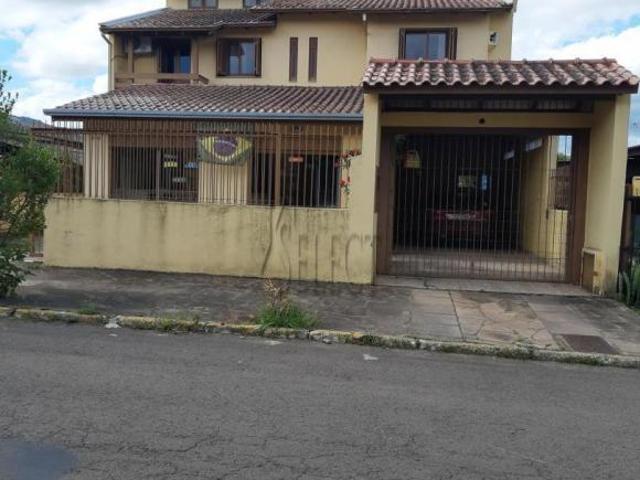 Sobrado com sala comercial