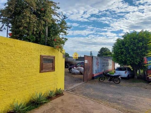 Sobrado de alvenaria com 2 terrenos na lateral Bairro Scharlau