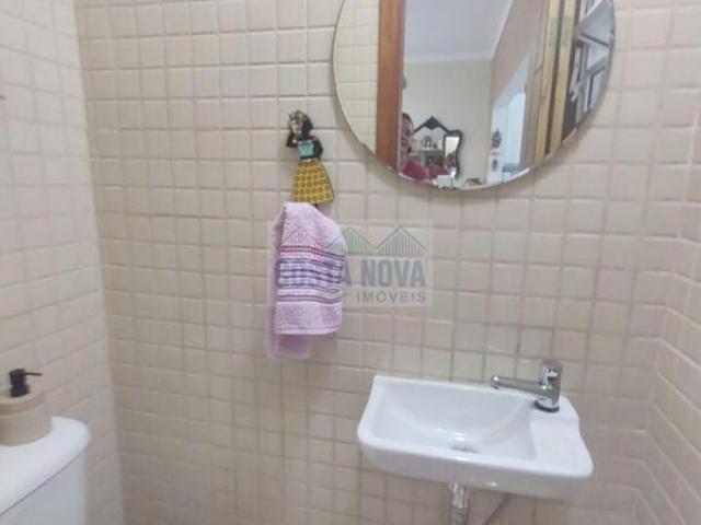 Sobrado de condomínio com 2 quartos sendo os 2 suítes, 1 vaga, bairro Guilhermina, Praia Grande