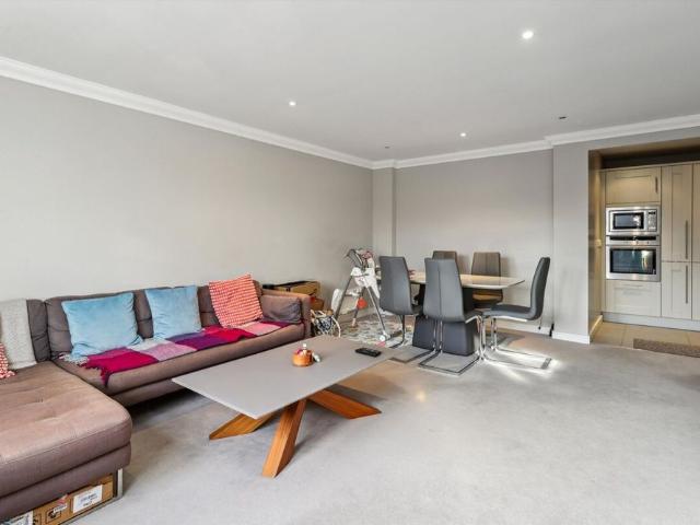 SOLE AGENT* A spacious two bedroom/two bathroom, lift serviced, second floor apartment with private, secure gated parking, in the centre of Esher