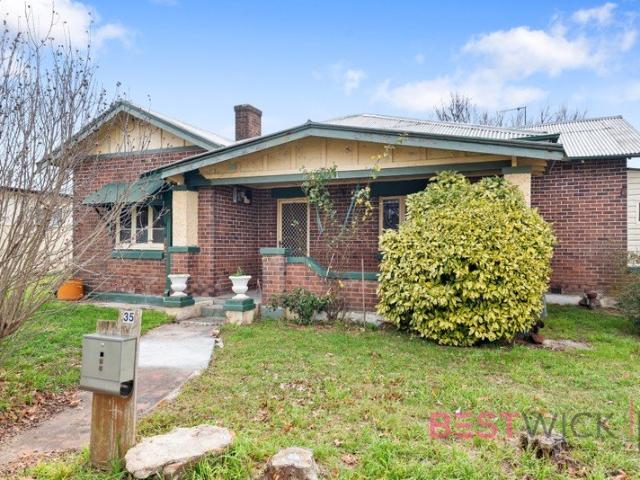 Solid Brick Character Home with Exceptional Potential