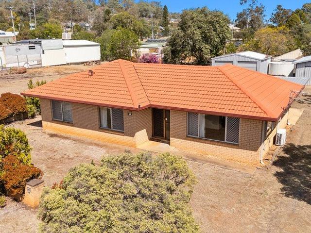 Solid Brick Home with Exceptional Shed Space