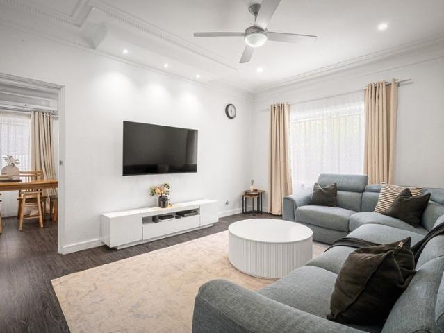 Solid double brick home with generous living and parking