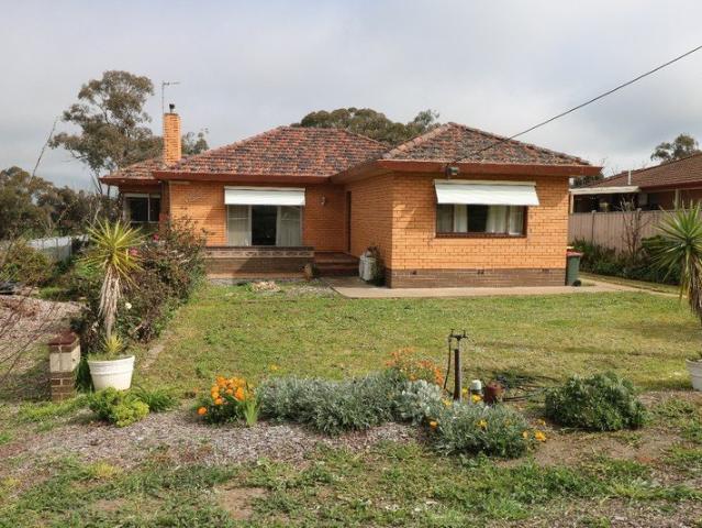 SOLID FAMILY BRICK HOME ON GOOD SIZE BLOCK
