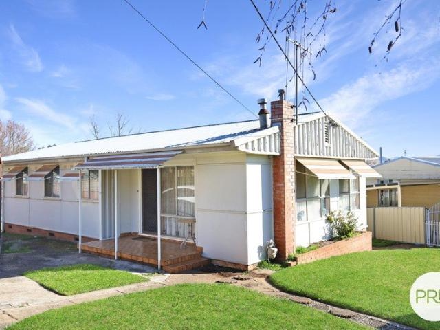 Solid Home, Great Tenant & Plenty of Potential