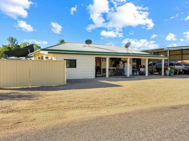 SOLID HOME WITH A HUGE CARPORT!