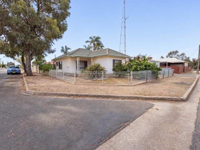 Solid Home with Renovation Potential on a Generous Corner Allotment