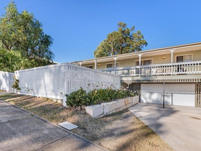 SOLID INVESTMENT WITH FAMILY APPEAL & EXCELLENT LOCATION