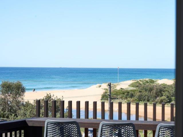 Sophisticated Coastal Living Just Moments from the Sand