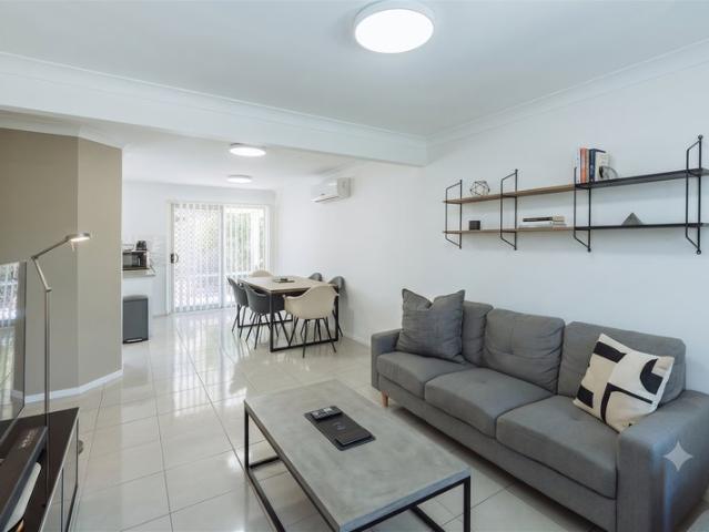 Sophisticated End Position Townhouse in Vibrant Pacific Pines | Skyline Sunrise Views & Turnkey Perfection