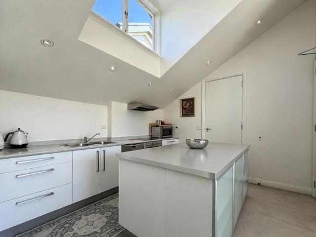 Sophisticated Furnished Living: Luxurious Loft Style Apartment in Melbourne's Prime Locale