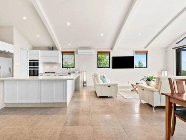 Sophisticated Family Living with Pool, Bay Views & Flexible Multi Level Design