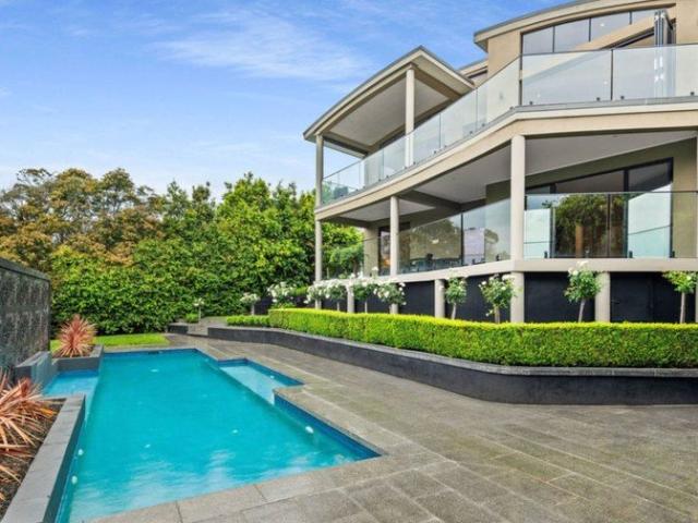 Sophisticated Family Living with Pool, Bay Views & Flexible Multi Level Design