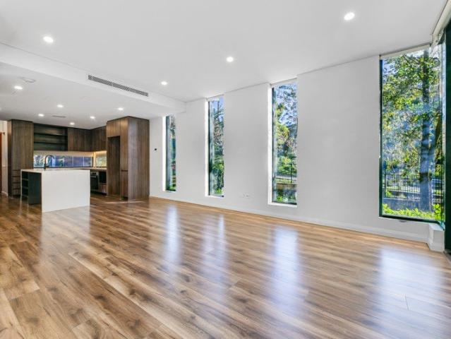 Sophisticated Four Level Townhouse with Dual Master Suites & Private Rooftop