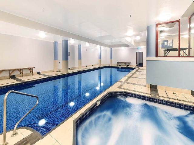 sleek one bedroom in millennium towers with parking!