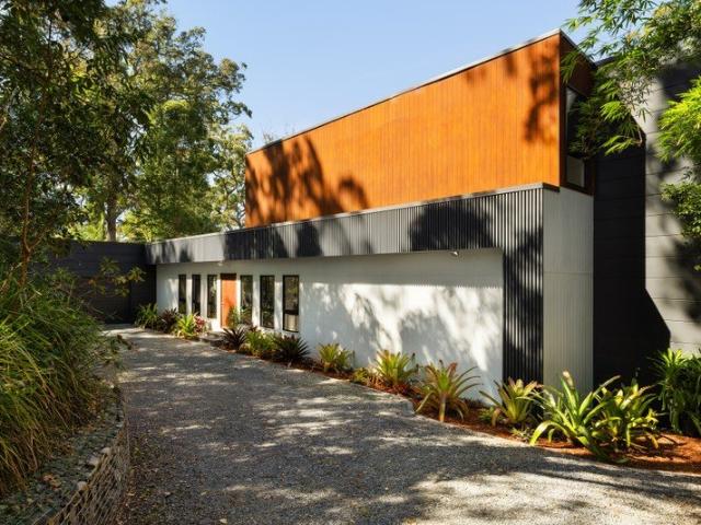 Sleek, Secluded Rainforest Acreage Retreat with Dual Living