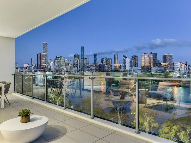 Smart Wired Riverfront Sub Penthouse with House Sized Living and City Skyline Views