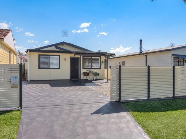 SMARTLY RENOVATED, LOW ON MAINTENANCE, HIGH ON CONVENIENCE