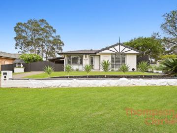 Space, Comfort & an Incredible 6 Car Garage in a Prime Location