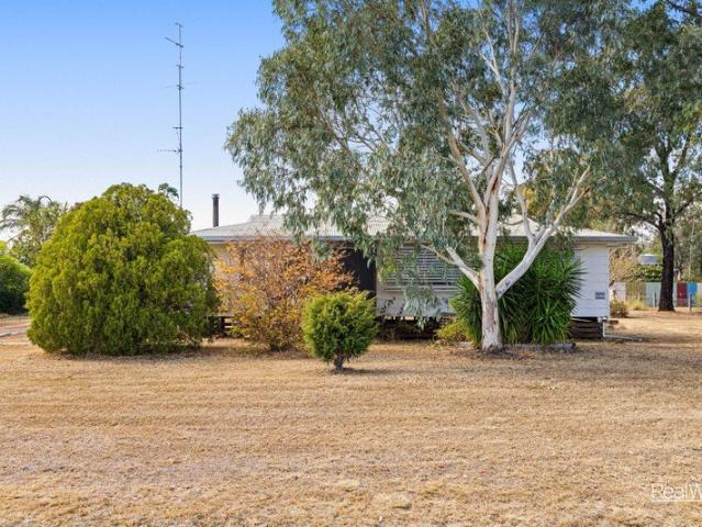 Space, Potential & Country Charm on a Full Acre
