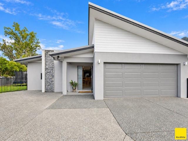 Space, privacy and a heated pool set against mountain views in a quiet Edmonton pocket