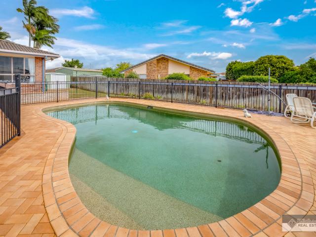 Spacious 4 Bedroom Brick Home with Sheds & Pool