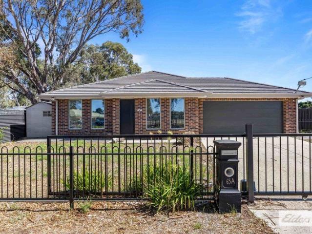Spacious 4 Bedroom Brick Home with Two Living Areas