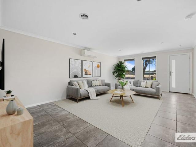 Spacious 4 Bedroom Brick Home with Two Living Areas