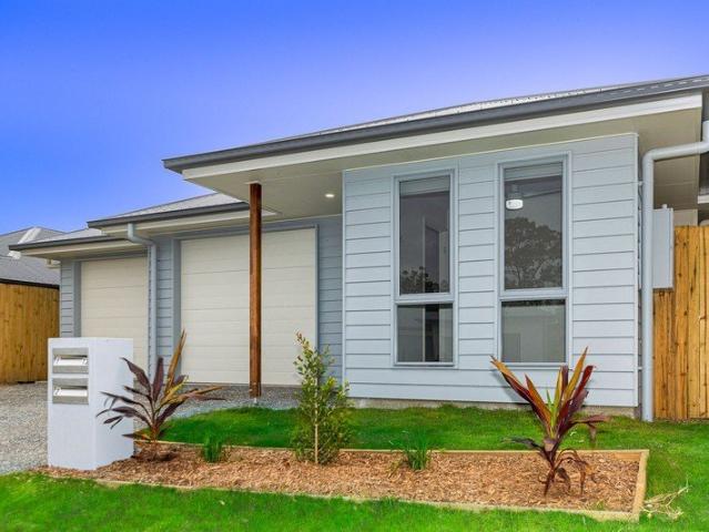 Spacious 4 Bedroom Home with Fenced Back Yard!