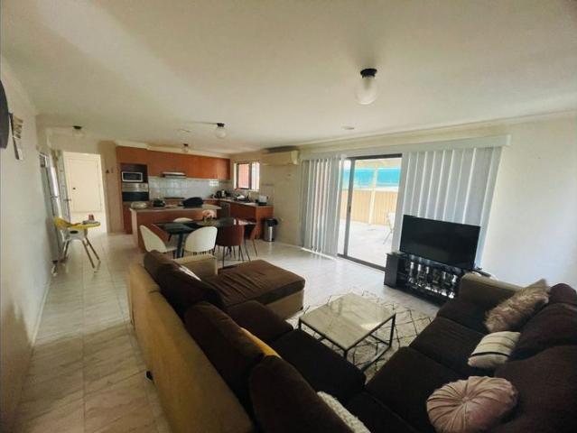 Spacious 4 Bedroom Home With Unique Outdoor Living!