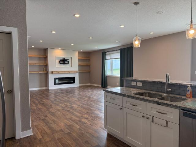 Spacious 4 Bedroom Twin Home | 3 Stall Garage + Fenced Yard