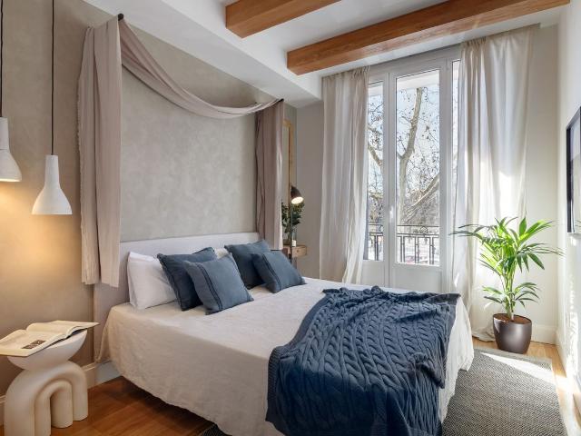 Spacious 3 Bedroom Apartment with Indonesian Inspired Design and Private Office in Ibiza Neighborhood, Madrid Amsterdam Apartments for Rent