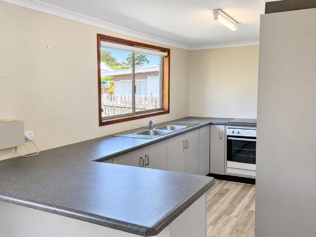 Spacious 3 Bedroom Home with Massive 3 Bay Shed in Popular Centenary Heights!