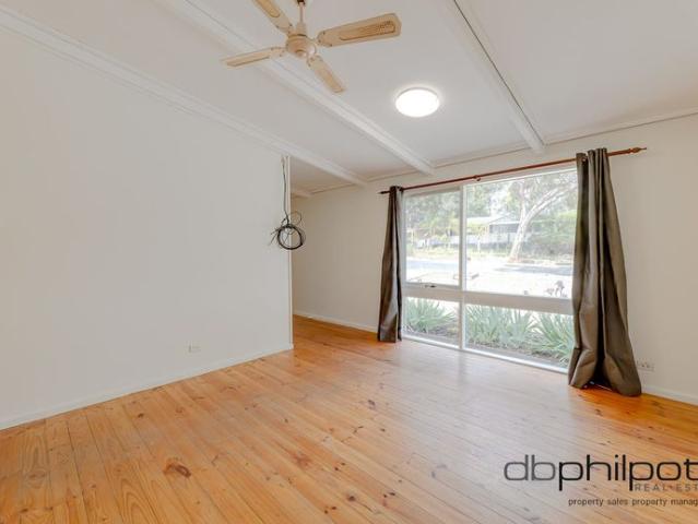 Spacious Three Bedroom Family Home with Modern Comfort and Convenient Parking