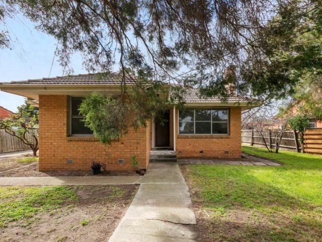 Spacious Three Bedroom Residence with Expansive Yard