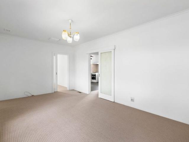 Spacious Three Bedroom Residence with Expansive Yard