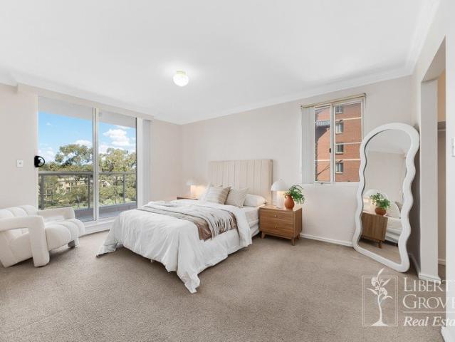 Spacious Three Bedroom Residence with Sweeping Olympic Park & Homebush Bay Views