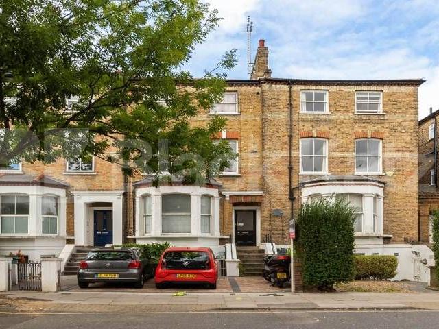 Spacious three bedroom with a modern kitchen wood floors mins to tube & shops