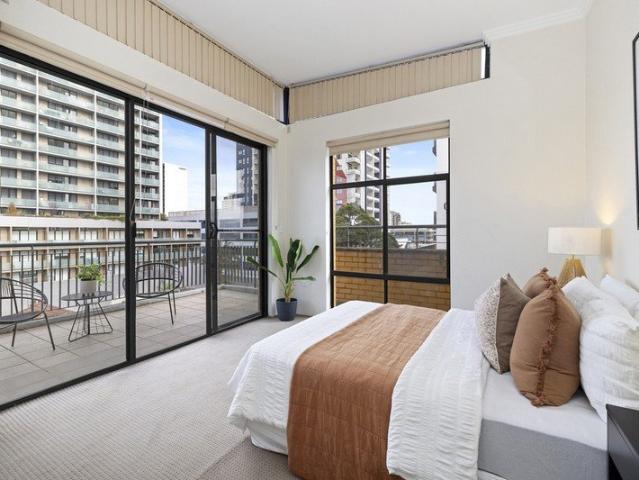 Spacious Top Floor Apartment with Expansive Wraparound Terrace in the Heart of Burwood