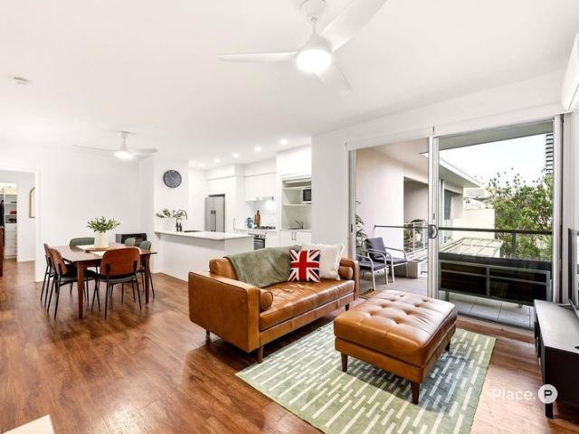 Spacious Top Floor Living in Boutique Fuel Apartments Moments from King Street