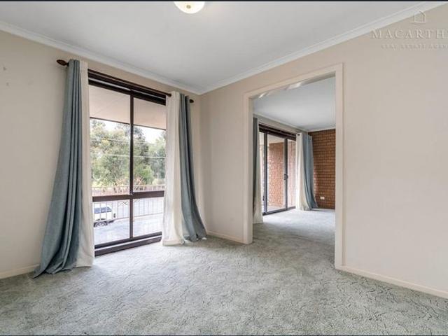 Spacious Top Floor Unit in the Heart of Town