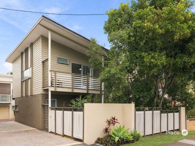 Spacious Townhouse Living with a Private Grassed Backyard
