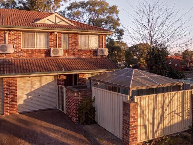 Spacious Townhouse with Inviting Living Areas and Prime Location