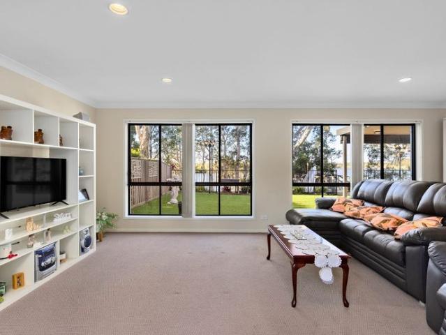 Spacious Waterfront Family Home with Stunning Coombabah River Views