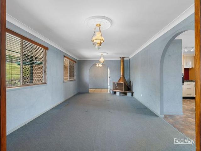 Spacious Acreage Living with Exceptional Shedding