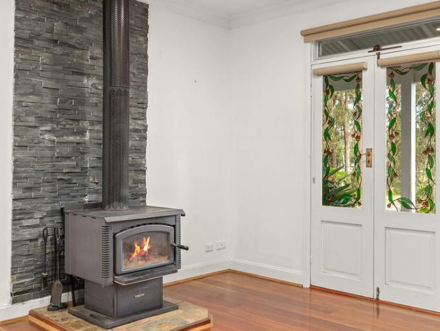 Spacious Acreage Living with Established Gardens and Versatile Outbuildings
