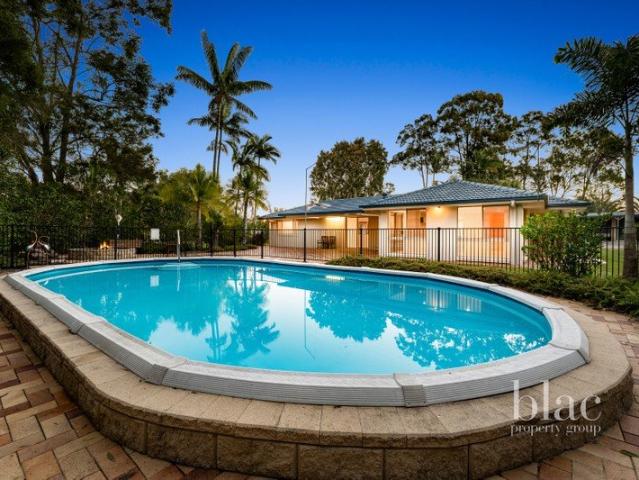 Spacious Acreage Living with Pool and Four Bay Shed