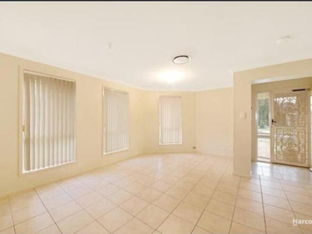 Spacious and fully tiled, four bedroom home!